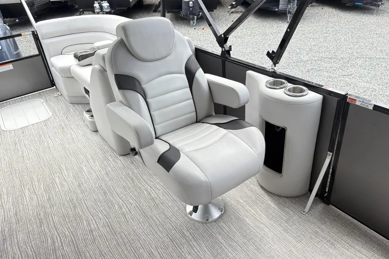 Slide: The Image of Luxurious seating on 2023 SunCatcher X322 RC boat with cup holders and modern design. - 12