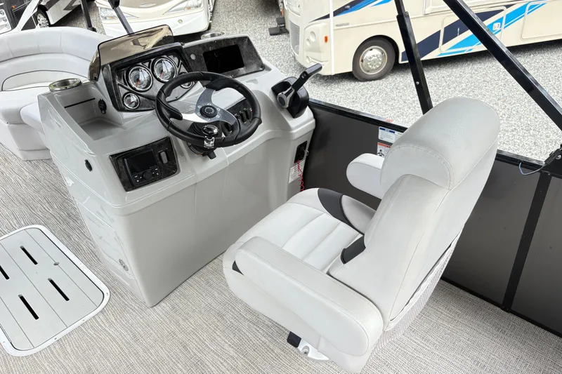 Slide: The Image of 2023 SunCatcher X322 RC boat helm with steering wheel and captain's chair. - 14