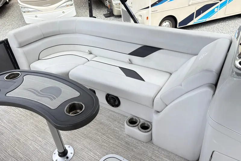 Slide: The Image of Luxurious seating area on 2023 SunCatcher X322 RC boat with cup holders and sleek design. - 19
