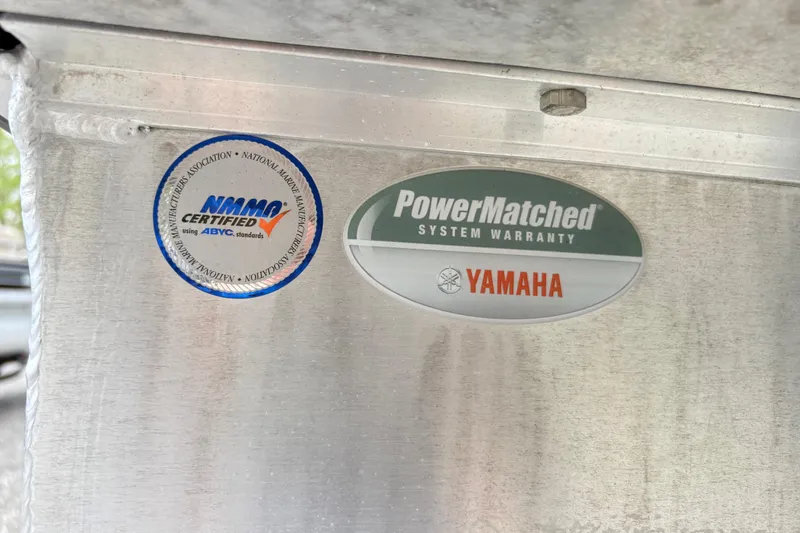 Slide: The Image of Stickers on SunCatcher X322 RC, 2023 model, showing NMMA certification and Yamaha warranty. - 20