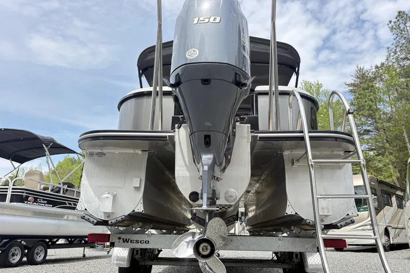 Slide: The Image of 2023 SunCatcher X322 RC pontoon boat with 150 HP engine on trailer. - 9