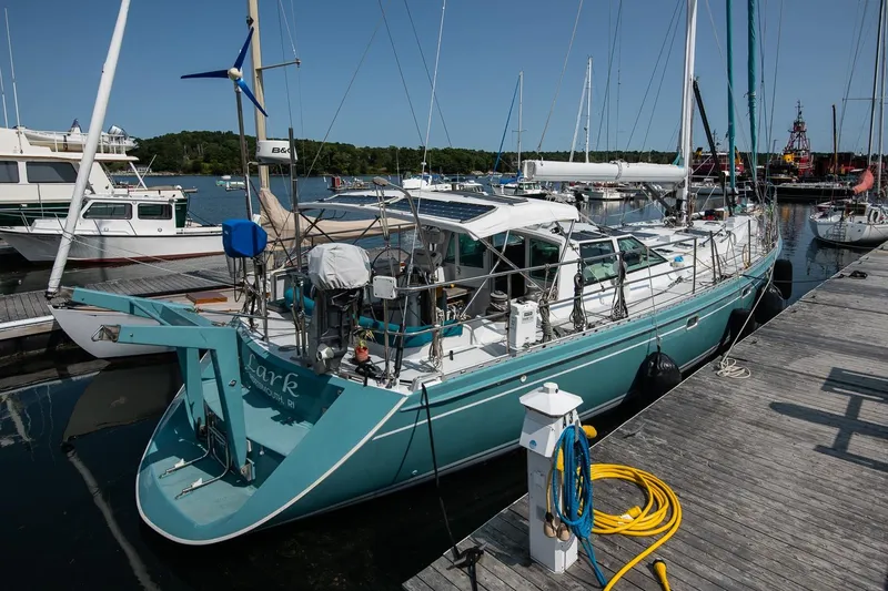 The Image of Sailboat Kanter Bougainvillea 62, 2001 model, docked at marina with clear blue sky. - 1
