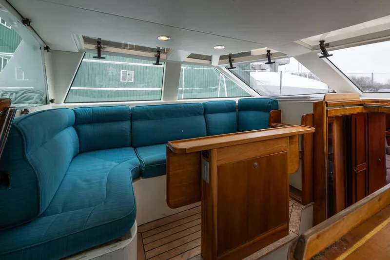 Slide: The Image of Interior of 2001 Kanter Bougainvillea 62 yacht with blue seating and wooden accents. - 11