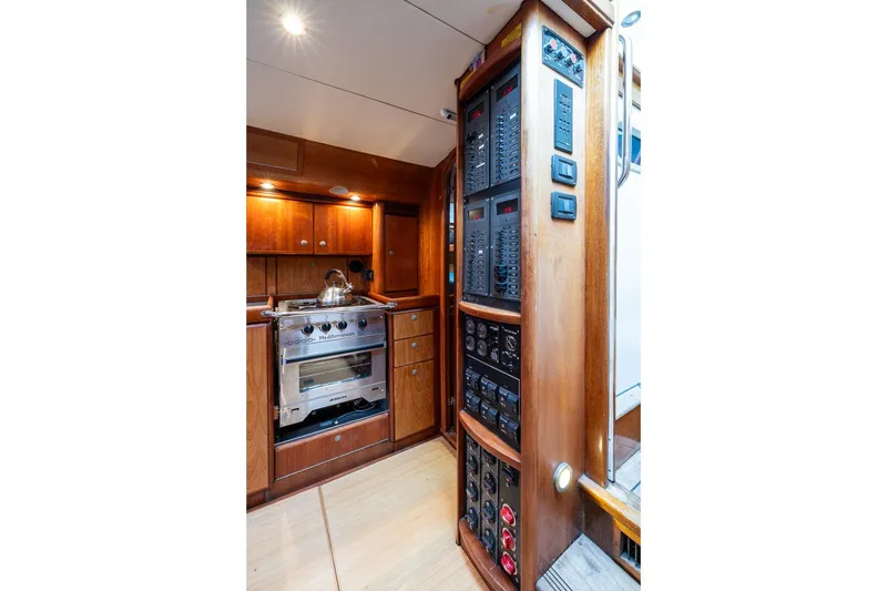 Slide: The Image of Interior of 2001 Kanter Bougainvillea 62 yacht with wooden cabinetry and control panels. - 19