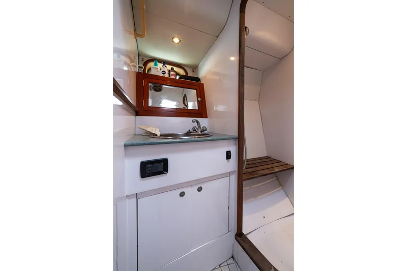 Slide: The Image of Compact bathroom interior of 2001 Kanter Bougainvillea 62 yacht with sink and storage. - 35