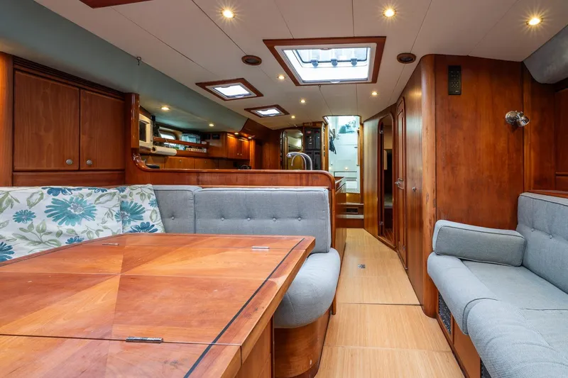 Slide: The Image of Luxurious interior of 2001 Kanter Bougainvillea 62 yacht with wooden finishes and plush seating. - 37