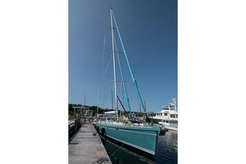 Slide: The Image of Sailboat Kanter Bougainvillea 62, 2001 model, docked at marina under clear blue sky. - 39