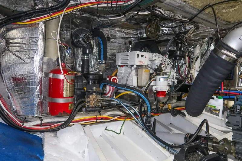 Slide: The Image of Engine room of a 2001 Kanter Bougainvillea 62 yacht, featuring complex wiring and machinery. - 38