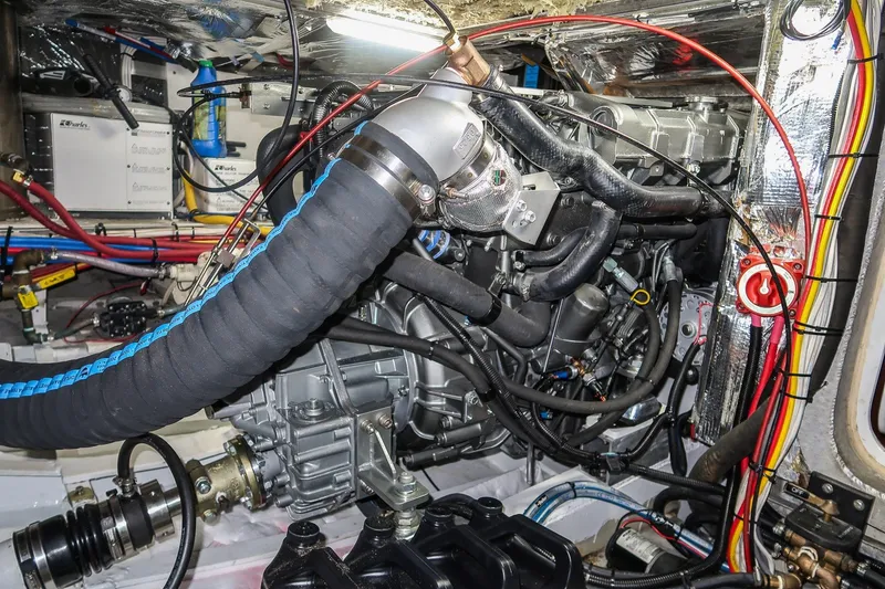 Slide: The Image of Engine compartment of a 2001 Kanter Bougainvillea 62 with visible hoses and wiring. - 41