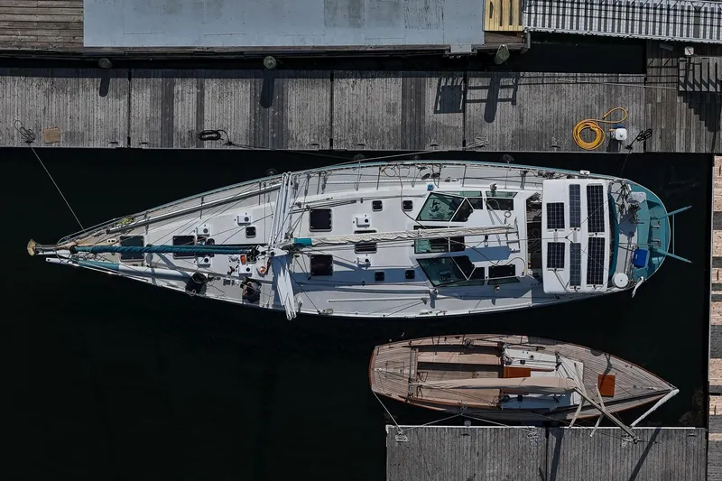Slide: The Image of Overhead view of 2001 Kanter Bougainvillea 62 yacht docked beside a smaller boat. - 5
