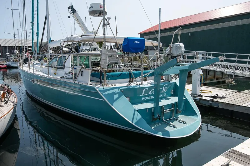 Slide: The Image of Sailboat Kanter Bougainvillea 62, 2001 model, docked at marina, turquoise hull. - 6