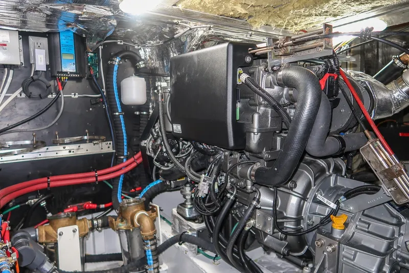 Slide: The Image of Engine room of a 2001 Kanter Bougainvillea 62 yacht, showcasing complex machinery and wiring. - 43