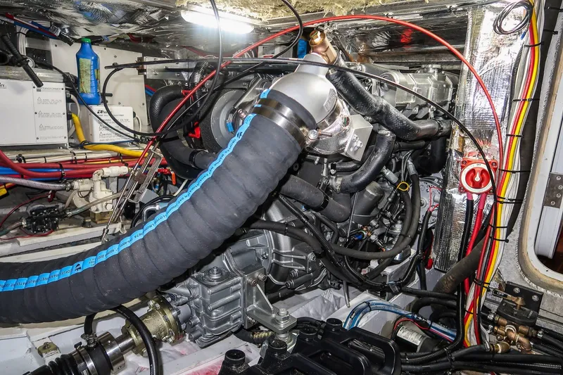 Slide: The Image of Engine room of a 2001 Kanter Bougainvillea 62 yacht, showcasing complex machinery and wiring. - 40