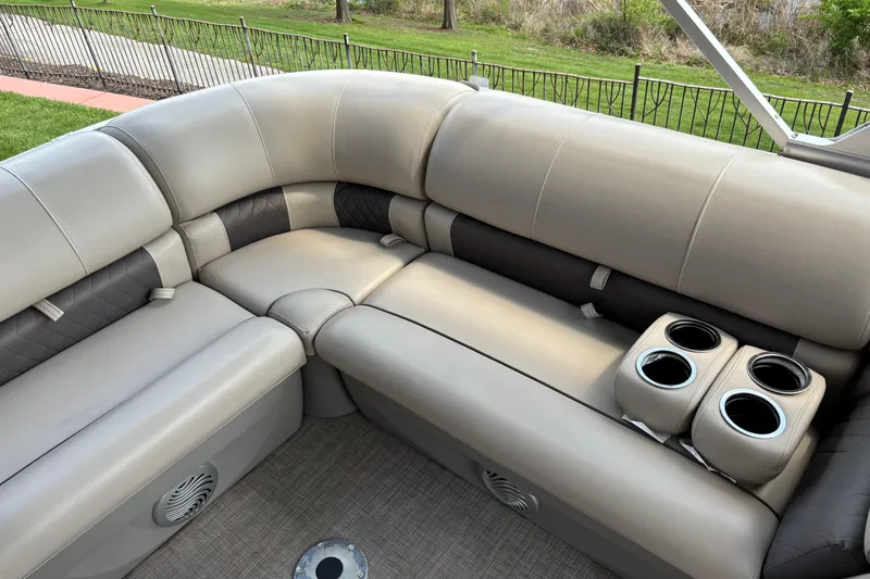 Slide: The Image of Luxurious seating on 2022 Sun Tracker Party Barge 20 DLX with cup holders and speakers. - 6
