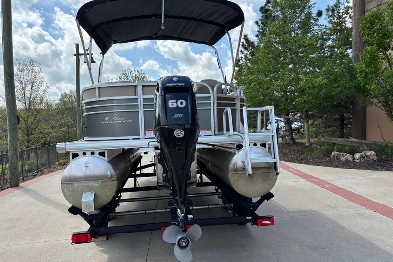Slide: The Image of 2022 Sun Tracker Party Barge 20 DLX pontoon boat with Mercury 60 engine on trailer. - 7
