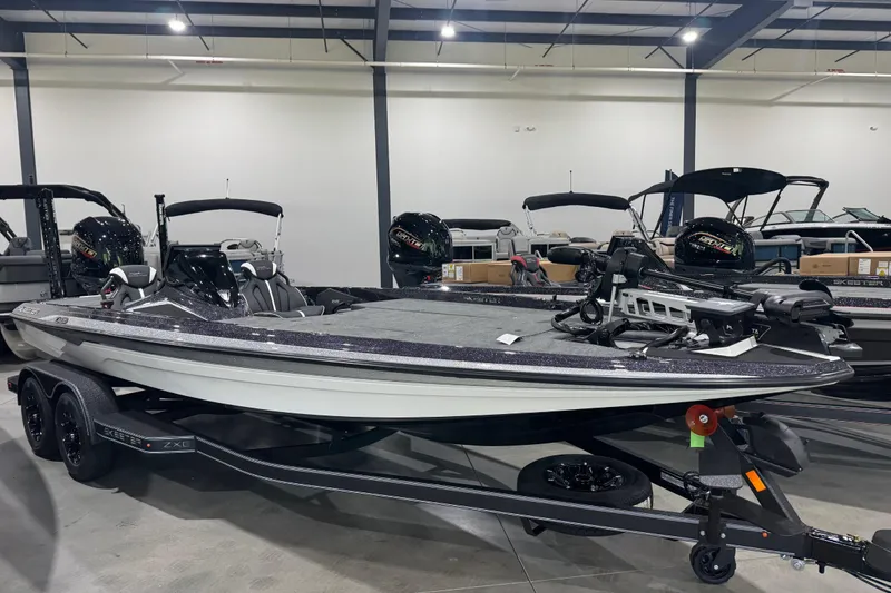 The Image of 2026 Skeeter ZXE21 bass boat displayed indoors on a trailer. - 0