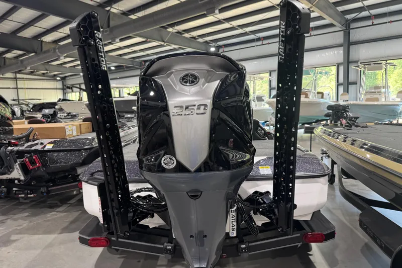 Slide: The Image of 2026 Skeeter ZXE21 boat with powerful 250 engine in showroom. - 10