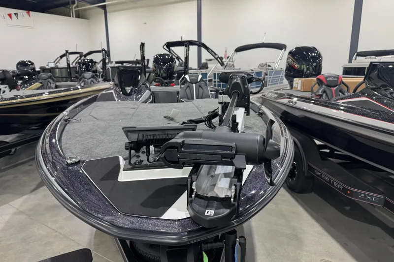Slide: The Image of 2026 Skeeter ZXE21 boat in showroom, featuring sleek design and advanced equipment. - 4