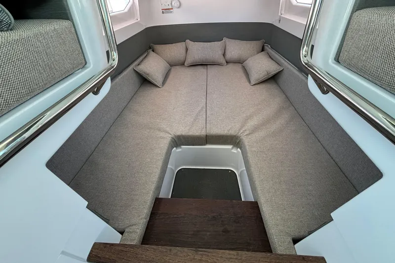 Slide: The Image of 2024 Axopar 37 XC Cross Cabin interior with cozy seating and cushions. - 20