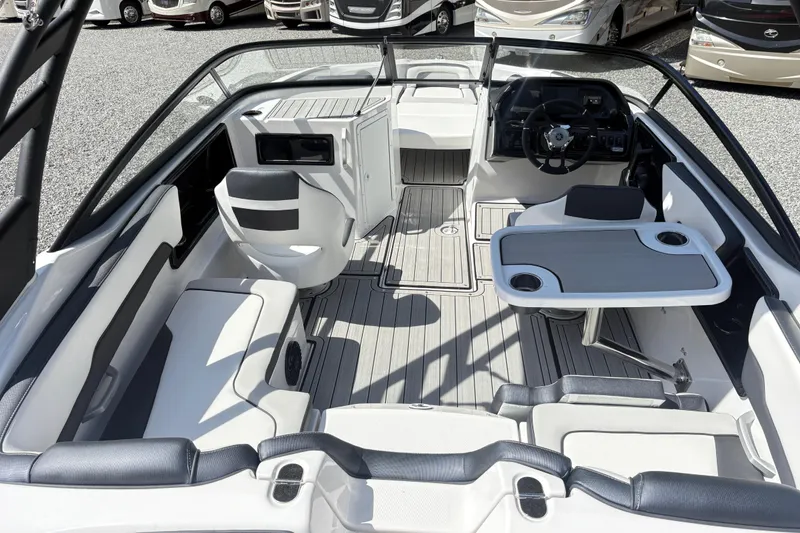 Slide: The Image of 2024 Yamaha Boats 195S interior with seating and table, showcasing modern design and functionality. - 10