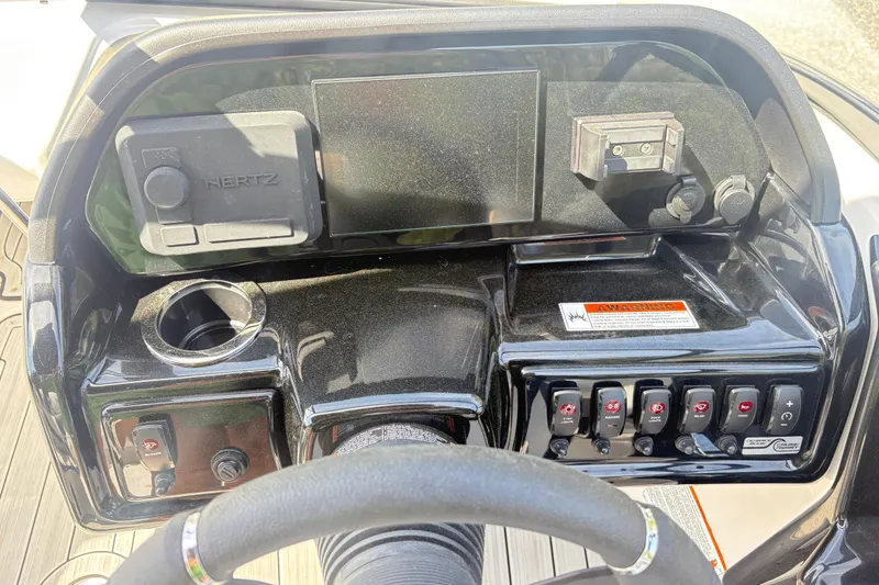 Slide: The Image of 2024 Yamaha Boats 195S dashboard with controls and display panel. - 14