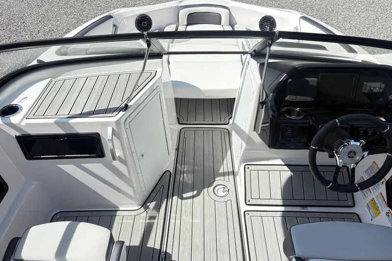 Slide: The Image of 2024 Yamaha Boats 195S cockpit with sleek design and modern steering console. - 9