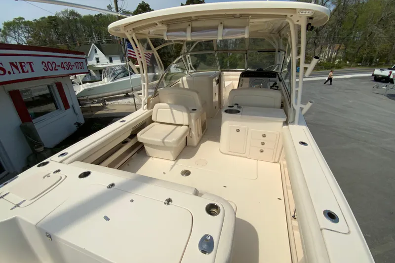 Slide: The Image of 2017 Grady-White Freedom 307 boat interior with seating and helm station. - 11