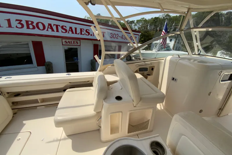 Slide: The Image of 2017 Grady-White Freedom 307 boat interior at a sales dealership. - 13
