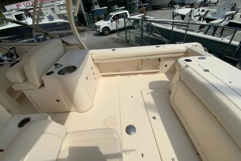 Slide: The Image of 2017 Grady-White Freedom 307 boat interior with seating and sink. - 15