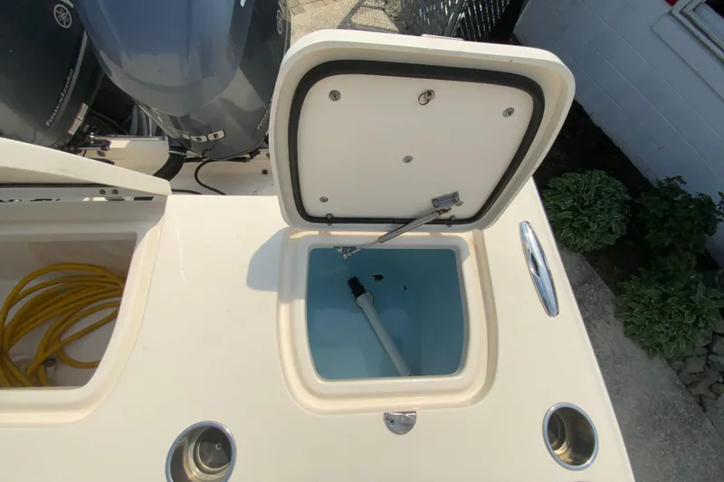 Slide: The Image of Open hatch on 2017 Grady-White Freedom 307 boat, revealing storage compartment. - 17