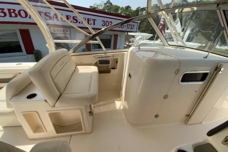Slide: The Image of 2017 Grady-White Freedom 307 boat interior with seating and helm area. - 24