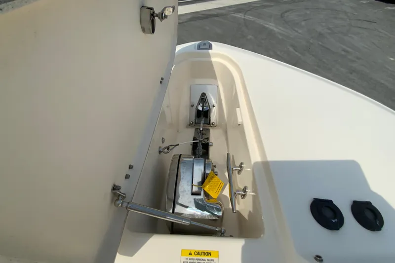 Slide: The Image of 2017 Grady-White Freedom 307 boat anchor compartment with open hatch. - 29
