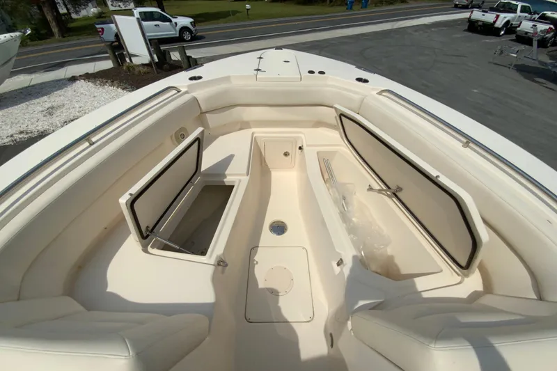 Slide: The Image of 2017 Grady-White Freedom 307 boat interior with open storage compartments. - 30