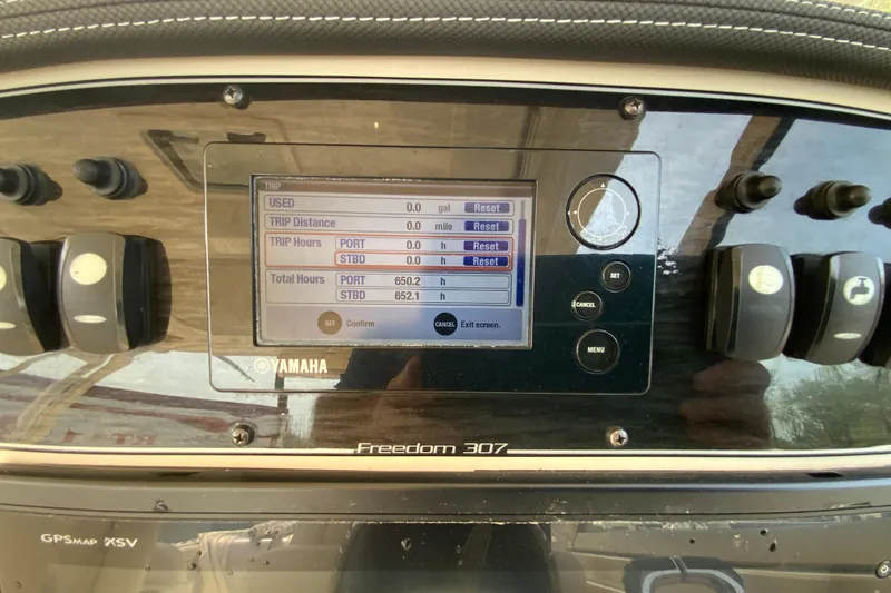 Slide: The Image of Dashboard of a 2017 Grady-White Freedom 307 boat with Yamaha display. - 36
