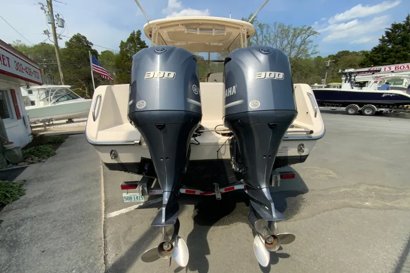 Slide: The Image of 2017 Grady-White Freedom 307 with twin Yamaha 300 engines, parked outdoors. - 9