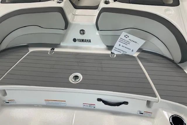Slide: The Image of 2025 Yamaha Boats AR190 interior with gray seating and deck, showcasing brand logo. - 11