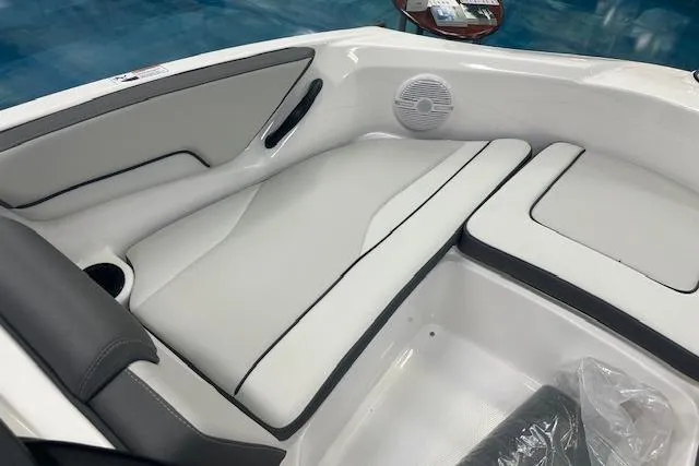 Slide: The Image of 2025 Yamaha Boats AR190 interior with sleek white seating and modern design. - 4