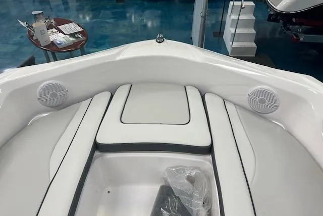 Slide: The Image of 2025 Yamaha Boats AR190 interior with white seating and built-in speakers. - 5