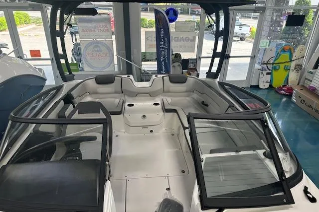 Slide: The Image of 2025 Yamaha Boats AR190 interior view in showroom, featuring spacious seating and modern design. - 6