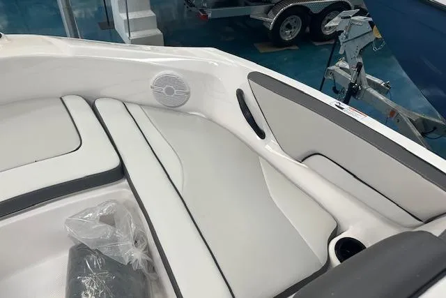 Slide: The Image of 2025 Yamaha Boats AR190 interior with white seating and speaker detail. - 8