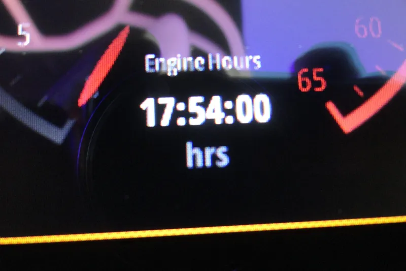 Slide: The Image of Dashboard displaying engine hours at 17:54:00 on a 2023 Chaparral 23 Surf. - 12