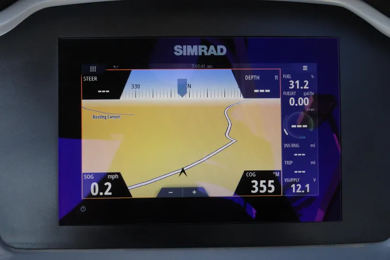 Slide: The Image of Simrad navigation display on 2023 Chaparral 23 Surf boat, showing map and data. - 13