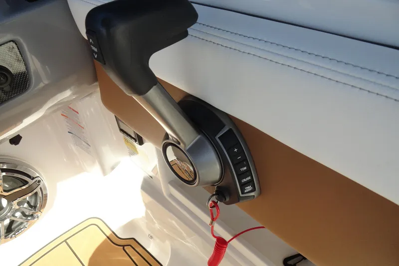 Slide: The Image of Throttle control of 2023 Chaparral 23 Surf boat with safety lanyard attached. - 14