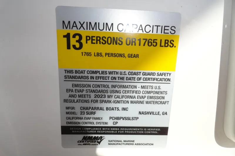 Slide: The Image of 2023 Chaparral 23 Surf capacity label: 13 persons or 1765 lbs, U.S. Coast Guard compliant. - 17