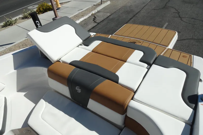 Slide: The Image of 2023 Chaparral 23 Surf boat with luxurious tan and white seating. - 26