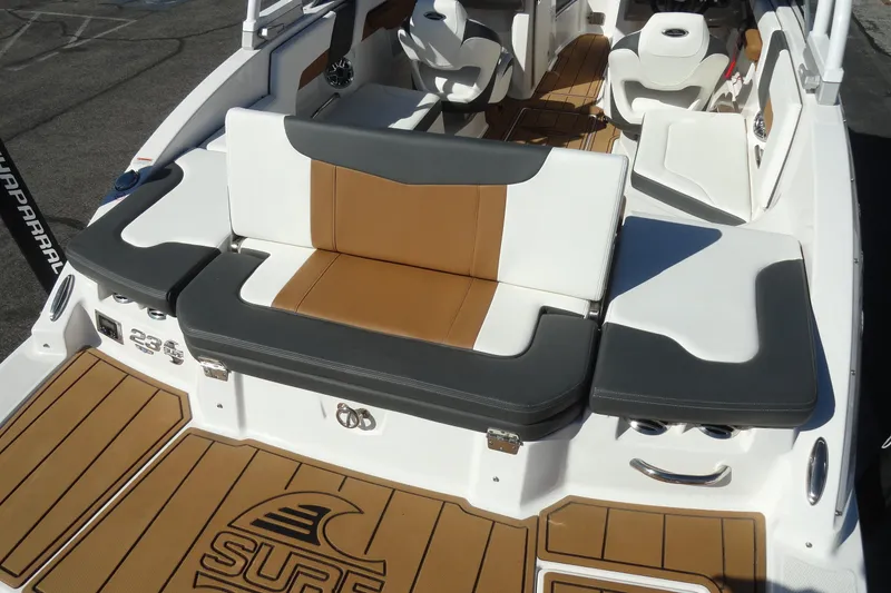 Slide: The Image of 2023 Chaparral 23 Surf boat interior with stylish seating and teak flooring. - 27