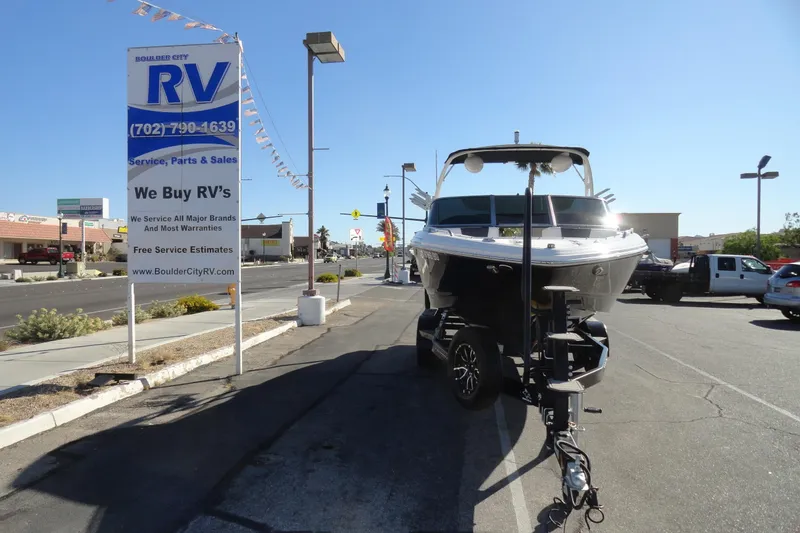 Slide: The Image of 2023 Chaparral 23 Surf boat on trailer at Boulder City RV dealership. - 3