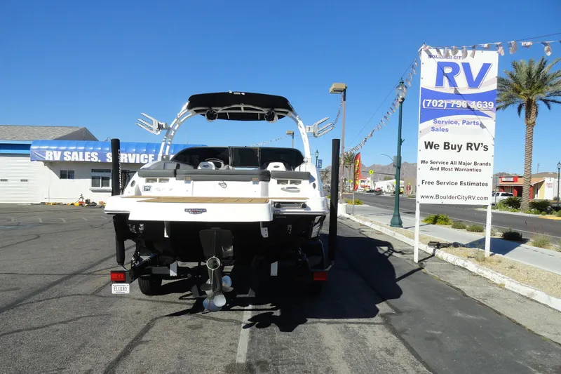Slide: The Image of 2023 Chaparral 23 Surf boat parked near RV sales and service center. - 30