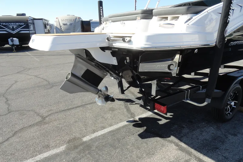 Slide: The Image of 2023 Chaparral 23 Surf boat rear view with propeller and trailer. - 7