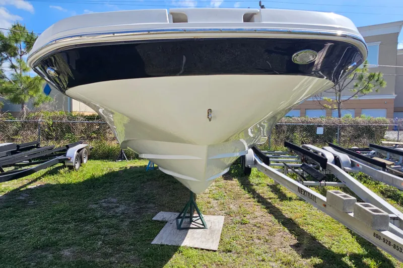 Slide: The Image of 2016 Hurricane SunDeck 2690 OB boat on trailer, viewed from front. - 14